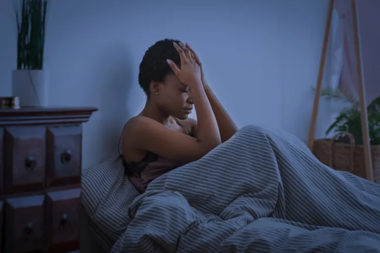 Cognitive Hypnotherapist Explains the Root Cause of ‘Tired But Wired’ Feeling — And What Can Help